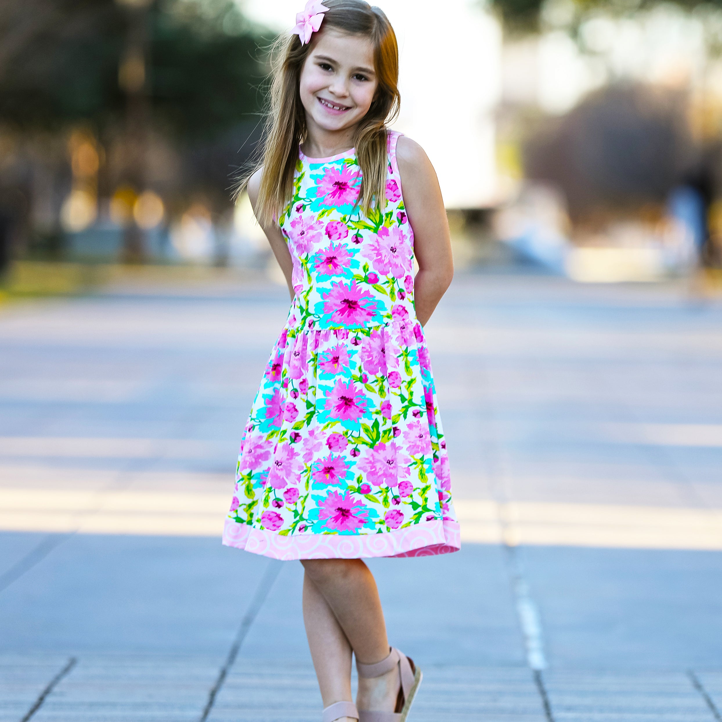 AnnLoren Little & Big Girls Floral Dress in green and pink, showcasing a vibrant floral pattern and sleeveless design, perfect for spring and summer.